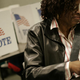 An early voter casts her ballot in Ohio. (J.D. Pooley/Getty Images)